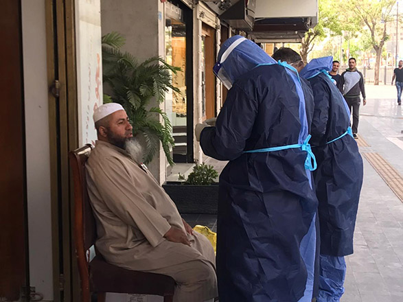 An epidemiological inspection team conducts a random test on a resident in Amman's Jabal Al Hussein area in this recent photo (JT photo)